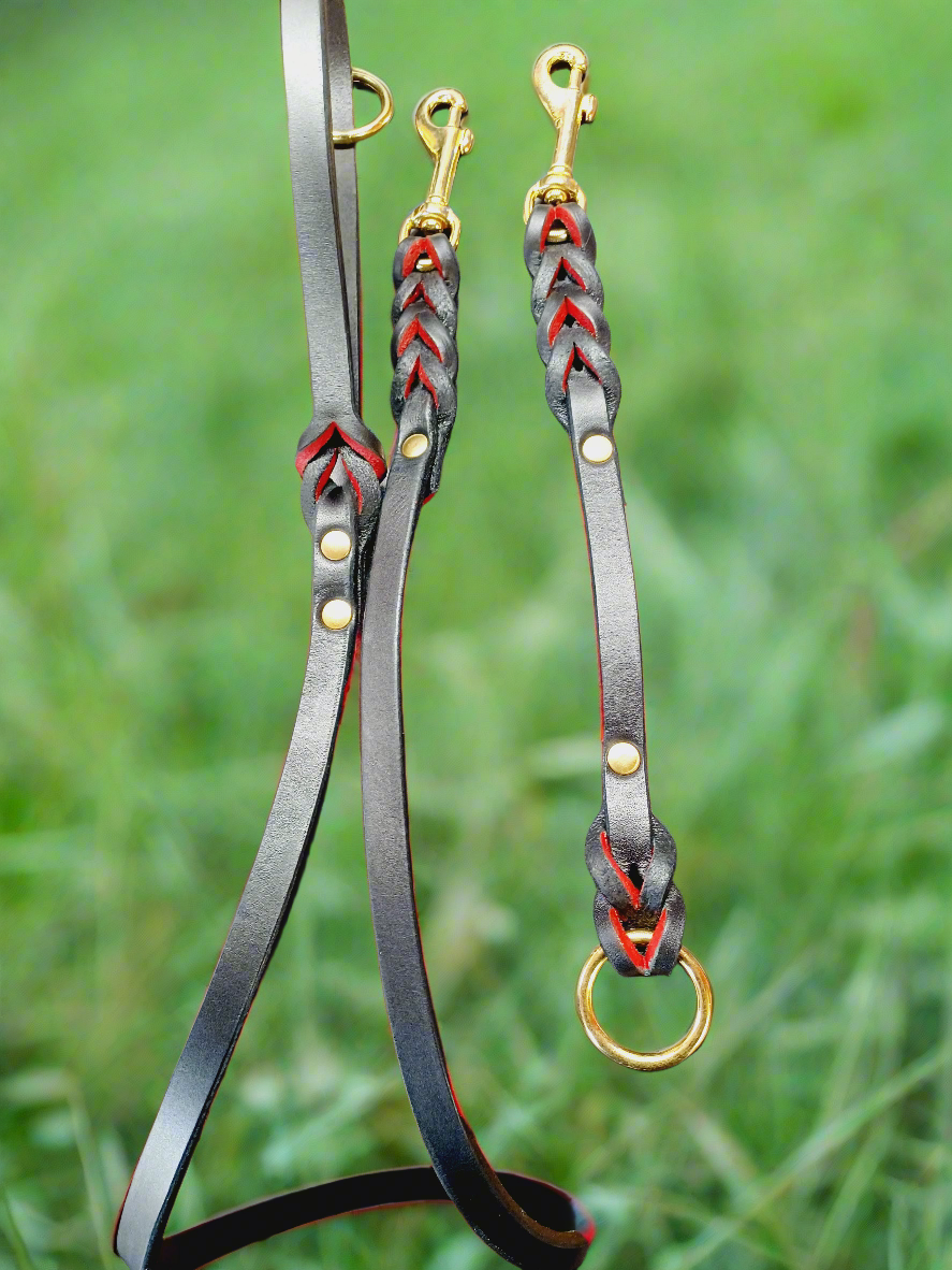 Red and black english bridle leash and training tab set .