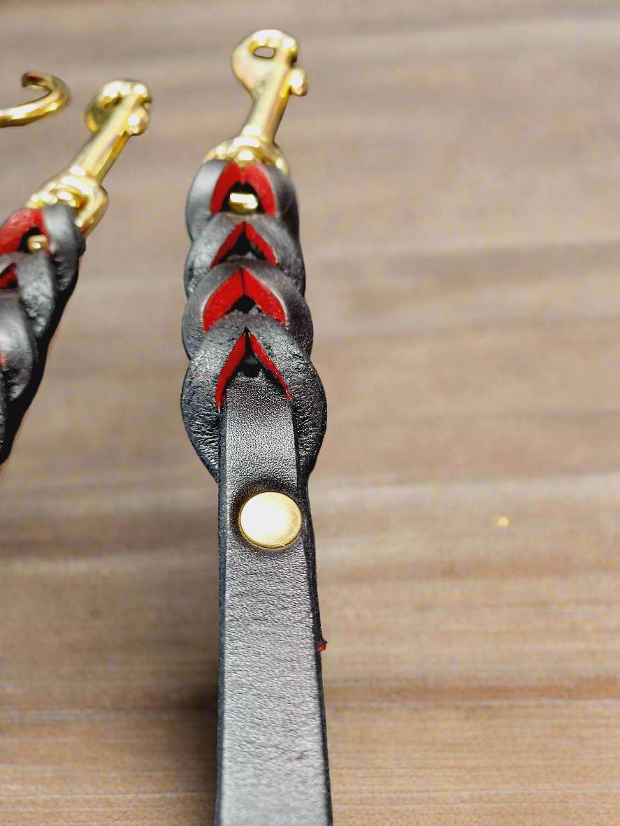 Red and black english bridle leash and training tab set .